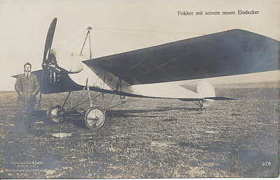 Anton Fokker with his new monoplane. Sanke card 329 of the Fokker Eindecker (E.I?). Although the rotary engine is clearly visible, the machine guns(? one?) are not. Fokker introduced the synchronized machine gun with the Eindecker.
Text:
Fokker mit seinem neuen Eindecker (Fokker with his new monoplane)
Postkartenvertrieb W. Sanke (W. Sanke Postcard sales)
Berlin N. 37
Nachdruck wird gerichtlich verfolgt (Reproduction will be prosecuted)
Reverse:
Message dated August 22 (?), 1916, field postmarked August 27, 1916