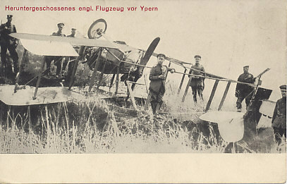 German soldiers, officers, and possibly the flyers who brought it down around an English pusher biplane shot down in the Ypres sector. The landing gear has been twisted at a right angle, and any bodies fell away or have been moved.
Text:
Heruntergeschossenes englisches Flugzeug vor Ypern
A shot-down English airplane Ypres
Reverse:
Kriegs-Erinnerungs-Karte
War Remembrance Card