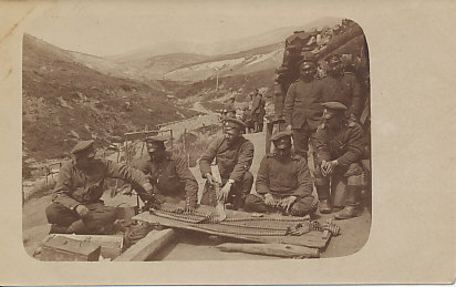 Bulgarian machine-gunners laying out ammunition belts on the Salonica Front.