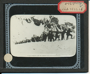 Glass slide of Italian soldiers carrying building material up a mountainside in the Dolomite Alps.
Text:
Italian soldiers carrying building material up the heights.
Photograph from Commando Supremo, Italian Army