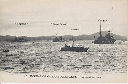 Battleships of the French War Navy in harbor including the Vergniaud, Edgard-Quinet, Mirabeau (in the distance), and Vérité.
Vergniaud and Mirabeau were 'semi-dreadnoughts' (Cuirassés d'Escadre) of the Danton class. Edgard-Quinet was a Croiseurs Cuirassés, an armoured cruiser. Vérité was a Cuirassé de deuxieme rang — a battleship of the second rank.
Text:
46 Marine de Guerre Française — Cuirassé sur rade
[Card] 46 French War Navy — Battleships in harbor
Vergniaud, Edgard-Quinet, Mirabeau, Vérité
Reverse:
Artaud et Nozais, Imp.-Édit., Nantes