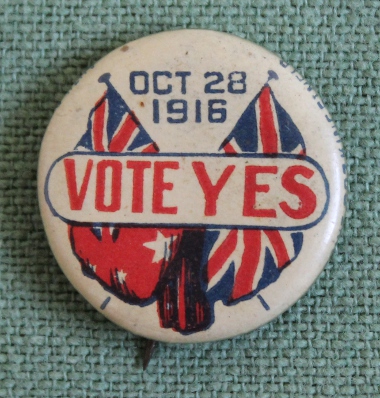 Vote Yes pin for Australian conscription, October 28, 1916, with the flags of Australia and Great Britain. A tin badge or tie-back pin in support of the Australian referendum on conscription, October 28, 1916. Australia voted no on this occasion and again, by a wider margin, in December, 1917.
Text:
Oct 28, 1916
Vote Yes