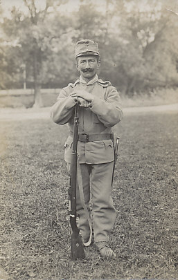 An Austro-Hungarian soldier posing for the camera, leaning on his rifle, bayonet at his waist. He is from the k.u.k (kaiserlich und königlich/imperial and royal) Landsturm Battalion No. 83, a reserve militia of men 34 to 55, some of whom saw active duty.
Reverse:
Stamped:
k.u.k (kaiserlich und königlich/imperial and royal) Landsturm Bataillon No. 83
Emil Lorenz, Photograph. Böhm Leipa Herrengasse 243
k.u.k (kaiserlich und königlich/imperial and royal) Landsturm Battalion No. 83