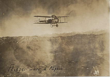 Hansa-Brandenburg C.I two-seater armed reconnaissance plane flying over the Alps. The distinctive radiator at the edge of the upper wing and rear-mounted machine gun are clearly visible. Of German origin, the plane was used extensively by the Austro-Hungarian forces.
Reverse (stamped):
Zensiert . . . [illegible]
Vervielfältigung verboten
(censored
reproduction prohibited)