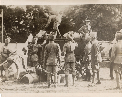 India soldiers unload a wagon. The caption on the back refers to the soldiers helping the Allies by 'unloading their baggage,' but Indian soldiers fought on their own.
Reverse:
India's army which is helping the allies unloading their baggage. (C) American Press Association
SEP 14 1914