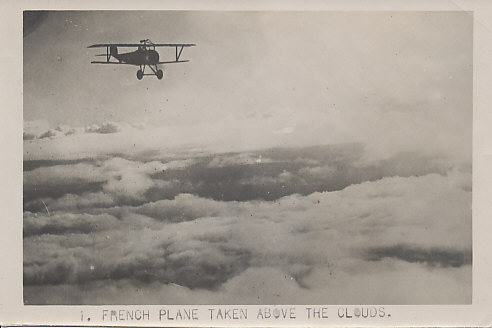 A French Nieuport fighter plane in flight, possibly a Nieuport 17, but possibly another model up to the Nieuport 27, with machine guns both above the upper wing, and along the fuselage.
The V struts, machine gun mounted above the upper wing, circular cowling, upward sweep of the tail, the tail itself, all mark the plane as a Nieuport.
Text:
1. French plane taken above the clouds.
Original 5x7 Aerial Photo. Reverse: blank.