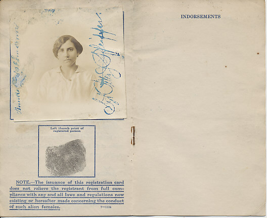 The United States Department of Justice Registration Card of Alien Female Anna Geiselmann of New York City. Issued July 8, 1918.
[page]
Photograph of Anna Geiselmann signed on the left side by her, and on the right by Sgt. Peter J. Pfeiffer
left thumb print of registered person
NOTE. — The issuance of this registration card does not relieve the registrant from full compliance with any and all laws and regulations now existing or hereafter made concerning the conduct of such alien females.
[Note: following pages blank other than as noted below.]
[Page]
Indorsements
[Page]
Indorsements Continued
[Inside and outside back cover]
Blank