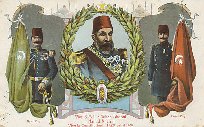 Postcard celebrating the 1908 military rebellion by the %+%Organization%m%45%n%Young Turks%-% that restored the constitution of 1876. Among the revolutionary leaders were Enver Bey, later %+%Person%m%49%n%Enver Pasha%-%, and Nyazi Bey. Sultan Abdul Hamid II was deposed in 1909, replaced by his brother %+%Person%m%82%n%Mohammed V%-%.
Text:
Vive S.M.I. le Sultan Abdoul Hamid Khan II
Vive la Constitution! 11,/24 Juillet 1908.
Nyazi Bey; Enver Bey

Long live S.M.I. Sultan Abdul Hamid II Khan
Long live the Constitution! 11/24 July 1908.

Reverse:
Carte Postal
Union Postale Universelle
Correspondance : Adresse