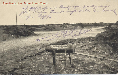 An unexploded American-made shell in the Ypres sector. The caption refers to it as American rubbish, making two points: American companies were selling weapons to the Entente Allies, but, even if Germany could buy them, they could not get through the British blockade. The unexploded shell is also a statement that American shells were duds, poorly made, and did not explode.