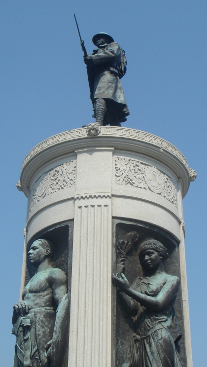 Detail of the Victory Monument commemorating the Eighth Regiment of the Illinois National Guard, an African-American unit that served in France reorganized as the 370th U.S. Infantry Regiment of the 93rd Division. The bronze sculpture is by Leonard Crunelle and was erected in 1927.
The regiment saw action at St. Mihiel, the Argonne Forest, Mont des Singes, and in the Oise-Aisne Offensive. The monument lists the names of the 137 soldiers of the regiment who lost their lives in the war.