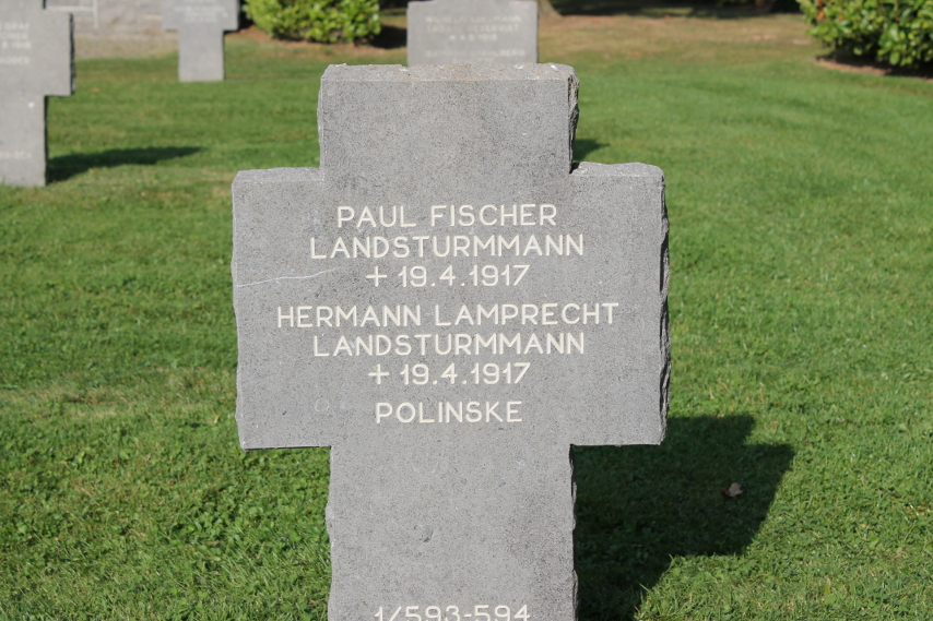 Headstone in the German Cemetery at Cerny-en-Laonnois for the graves of the Landsturm infantrymen Paul Fischer and Hermann Lamprecht, both died April 19, 1917 during the Second Battle of the Aisne. The grave contains the remains of 'Polinske', dead with no further information. The %i1%Landsturm%i0% were reserve units, typically of older men.
Text:
Paul Fischer Landsturmmann +19.4.1917
Hermann Lamprecht Landsturmmann +19.4.1917
Polinske
