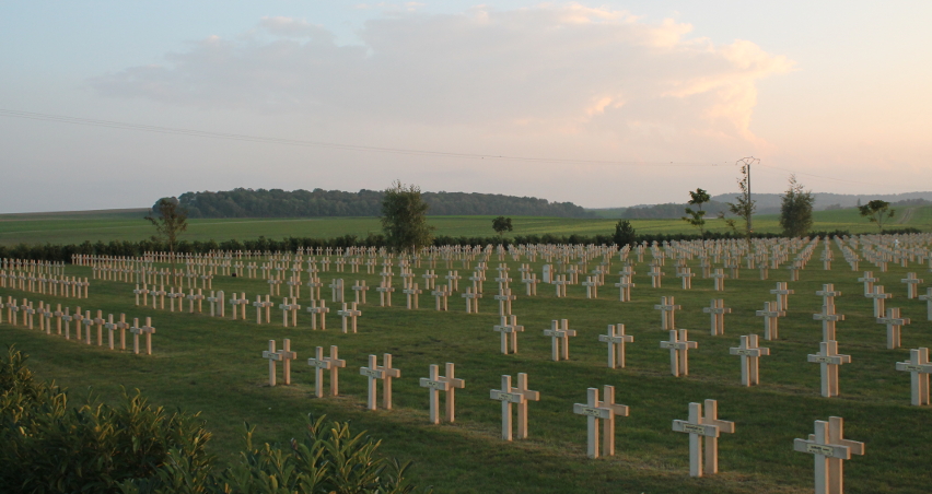 Headstones at La Nécropole Nationale de Pontavert. The cemetery contains the remains of 6,815 soldiers, 67 of them British, 54 Russian, and the remainder French. Of the total, 1,364 are entombed in the ossuary.