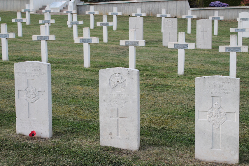 Three headstones at the Necropole Craonelle, a French military cemetery, of British soldiers who died May 27, 1918, most likely killed in the German Aisne offensive that began that day. From left to right the headstones are those of Norman Gibson, East Yorkshire Regiment, age 18; C. G. Sills, Machine Gun Corps; and G. Rees, Yorkshire Regiment. Webmatters.net includes these men and two others noting that, 'These men were caught up the whirlwind of Operation Blücher launched by the Germans on the morning of 27th May 1918. They were part of the 150th Brigade of 50th Division holding the Plateau de Californie and Craonne.'
Text:
41629 Private Norman Gibson, East Yorkshire Regiment, 27th May 1918, Age 18
67830 Private C. G. Sills, Machine Gun Corps (Inf.), 27th May 1918, Age 33
34962 Private G. Rees, Yorkshire Regiment, 27th May 1918